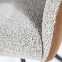 Fauteuil avec accoudoirs en tissu et simili et pieds étoile DILIS