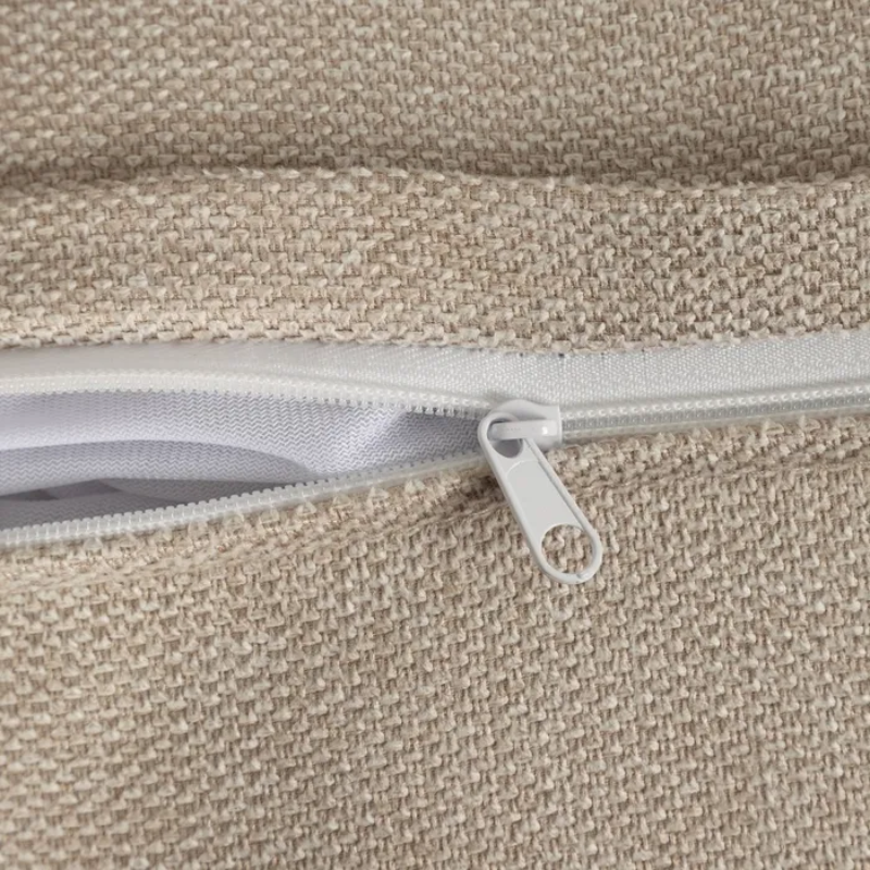 Canapé MORESIA de 3 places en tissu beige galbé avec coussins déco