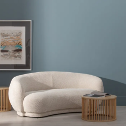 Canapé incurvé bouclette couleur beige CYMÉLIA au style cocooning